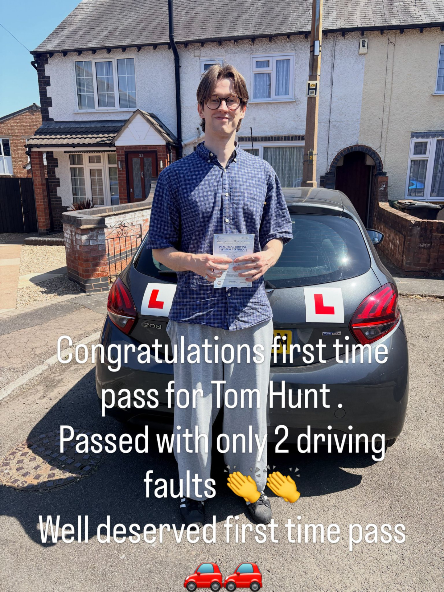 Tom Hunt celebrating a first-time driving test pass with only two driving faults