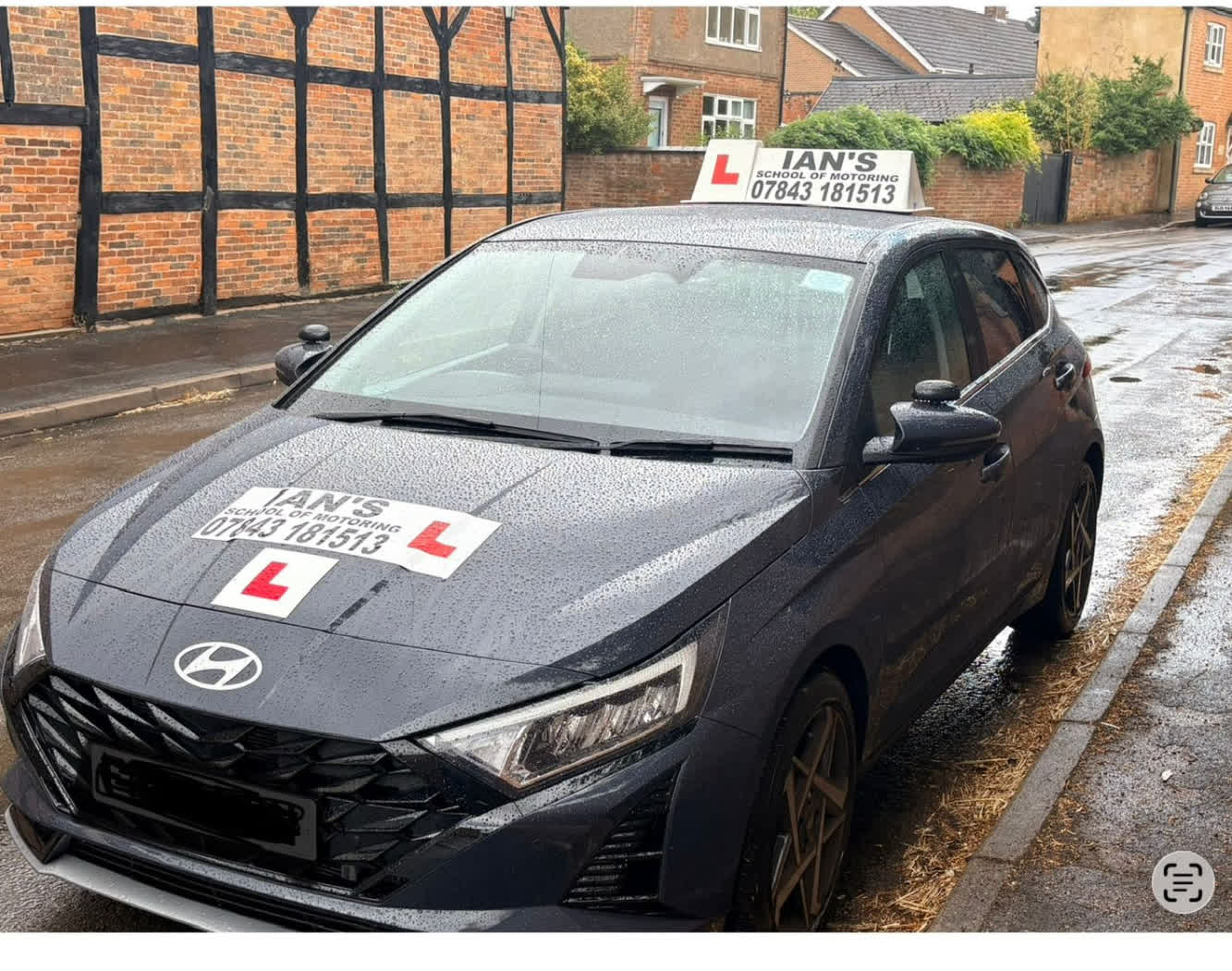Ian's School of Motoring learner car parked on a village street near Leicester